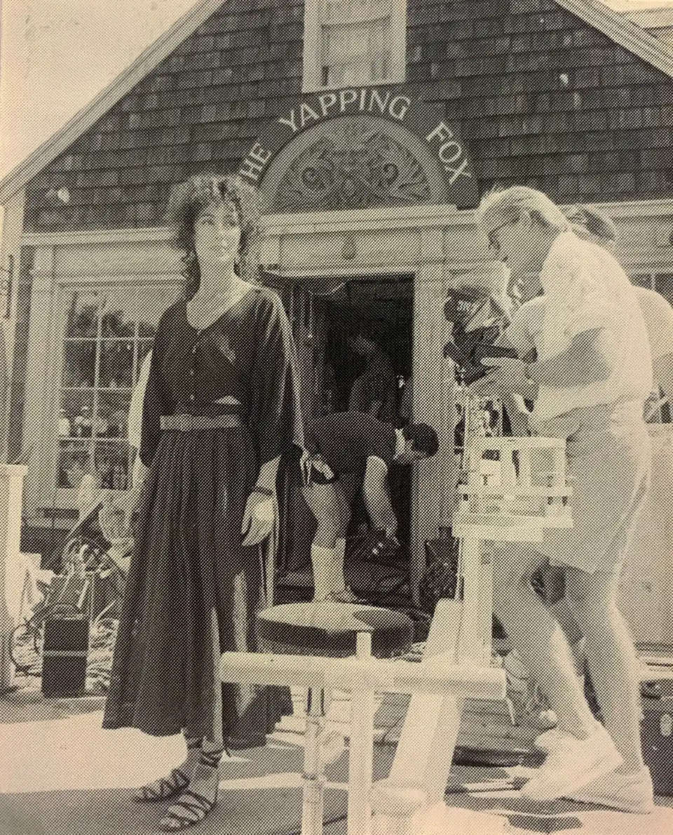Cher during filming of "The Witches of Eastwick" in Scituate Harbor in the Summer of 1986. The current Lucky Finn building, then home to The Quarterdeck gift shop, was renamed The Yapping Fox in the movie. [Mariner File Photo/Alan Chapman]